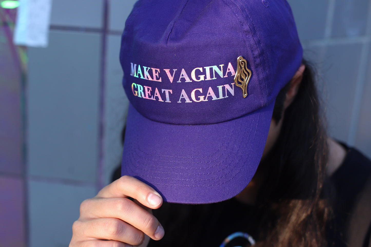 Holographic statement cap celebrating femininity, designed in Berlin with your favorite V pin. A collaboration by @happyvagina X @pynk_business.