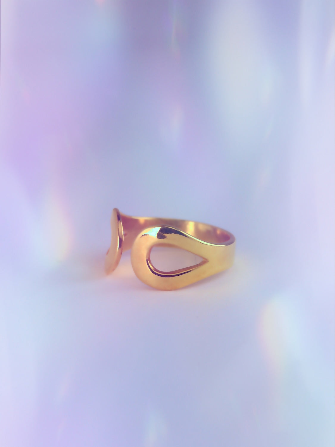 Whimsical yet elegant ringlet, worn on the upper finger. Inspired by tears of joy & letting go. Adjustable open cuff in 925 sterling silver or brass. Made in Germany.