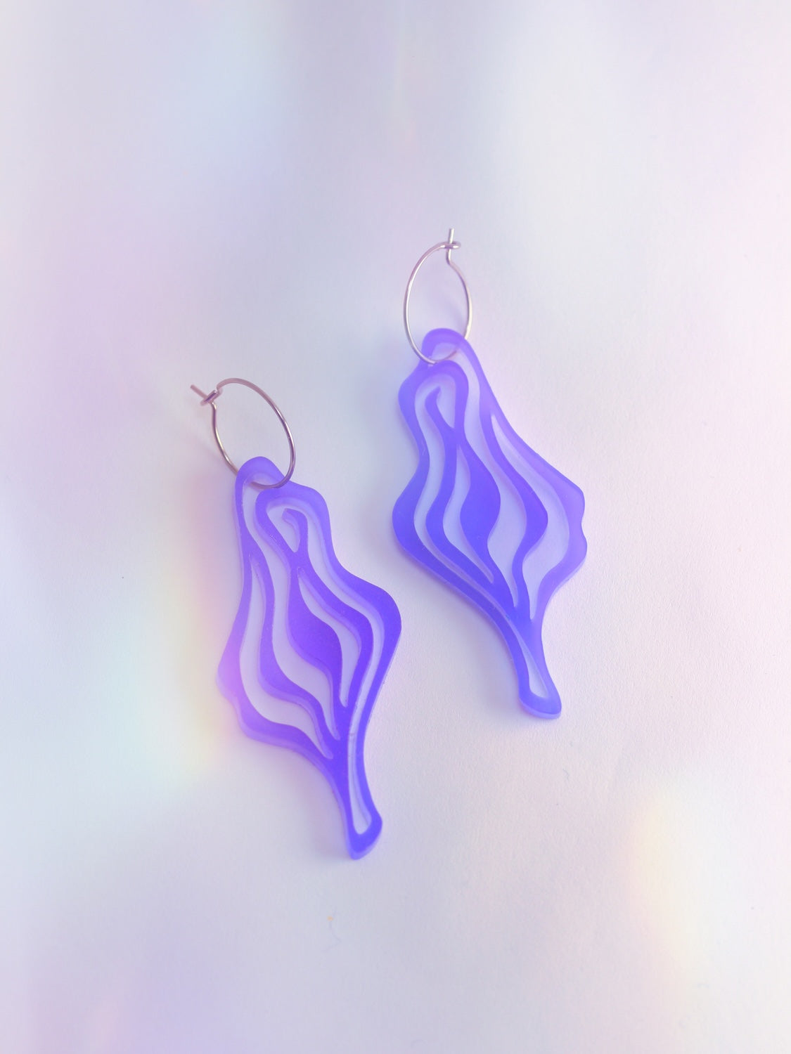 Spirited statement ear dangle celebrating your inner magic! Lightweight acrylic in seasonal colors, with hypoallergenic surgical steel loops. Made in Berlin.