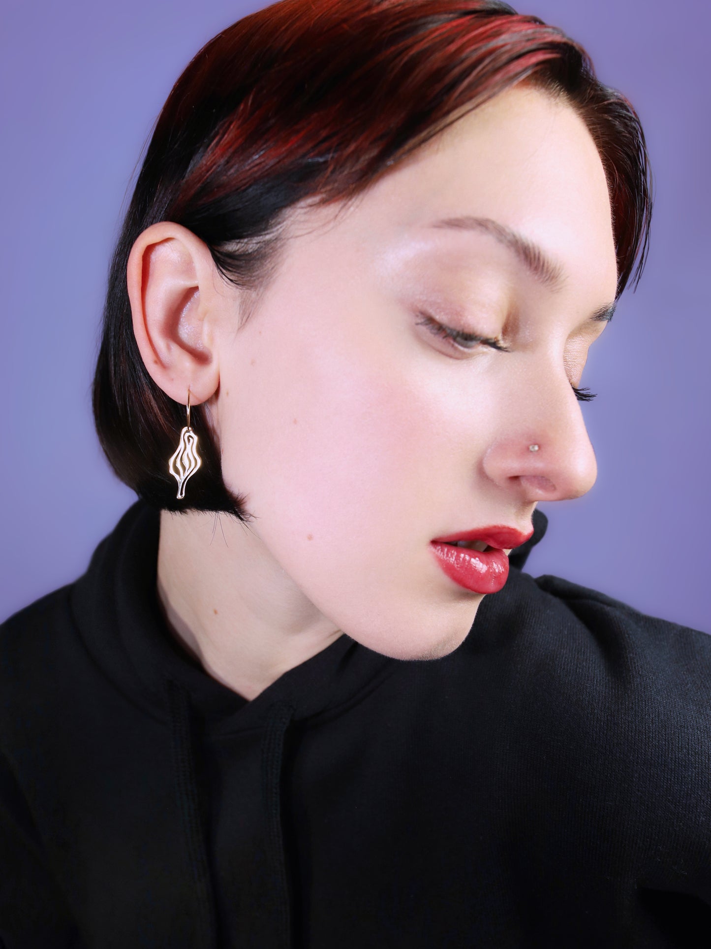 ICONIC ear dangle – a spirited statement of femininity & Berlin nightlife. Wear it solo or mix & match. Made in Italy from galvanized brass & surgical steel loops.